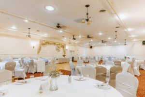 upstairs great room with decorated dining tables