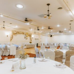 upstairs great room with decorated dining tables