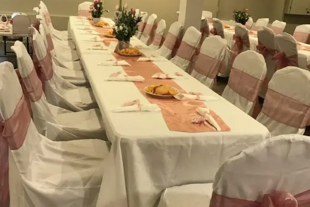 A fully decorated dining table with chairs