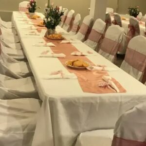 A fully decorated dining table with chairs